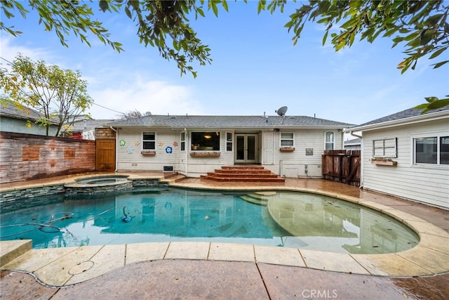 view of swimming pool featuring an in ground hot tub