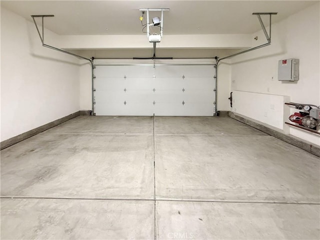 garage featuring a garage door opener and electric panel