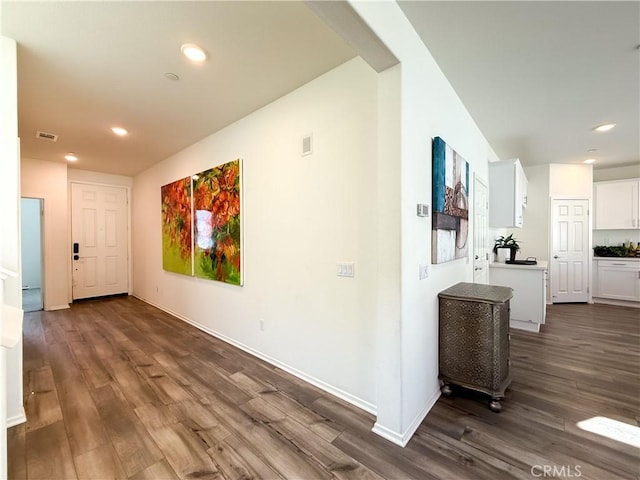 hallway with dark wood-type flooring