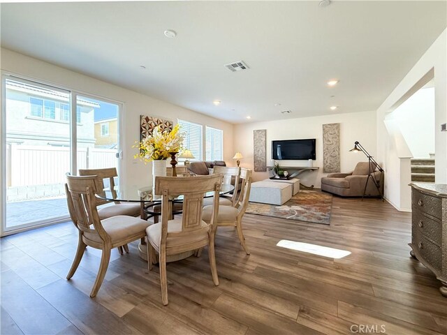 dining space featuring hardwood / wood-style flooring