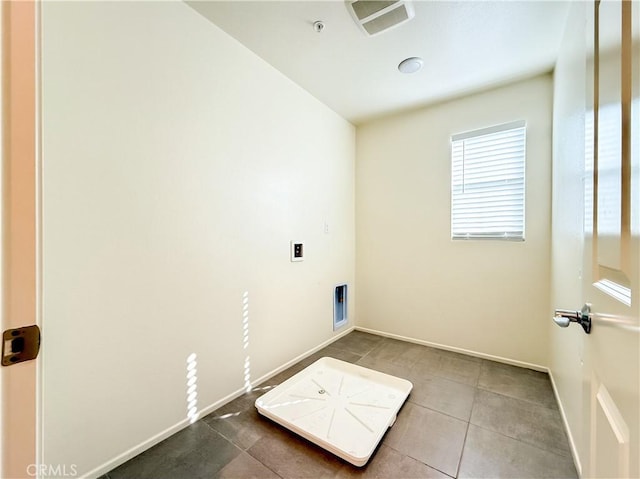 washroom featuring tile patterned flooring and hookup for a washing machine