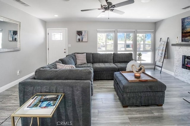 39120 Paradise Way, Cathedral City, CA 92234 - living room featuring hardwood / wood-style flooring, ceiling fan, and a fireplace