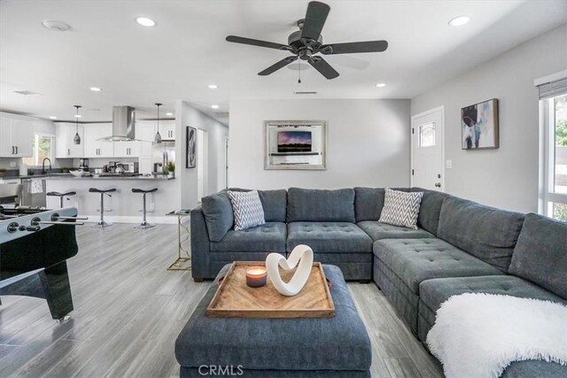 39120 Paradise Way, Cathedral City, CA 92234 - living room featuring sink, light hardwood / wood-style flooring, a healthy amount of sunlight, and ceiling fan