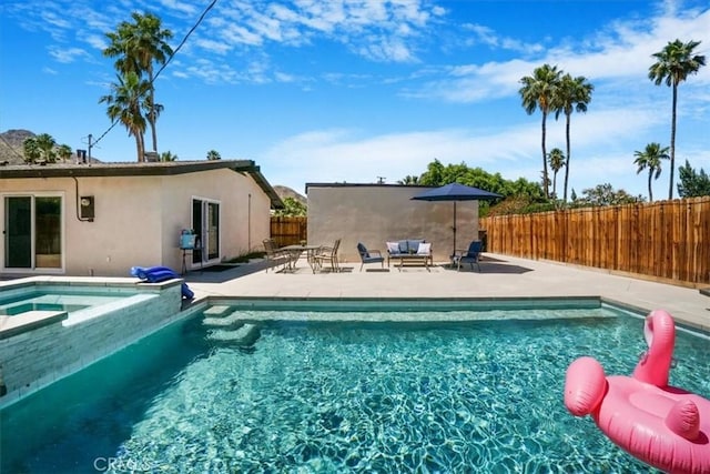 view of pool featuring an in ground hot tub and a patio area