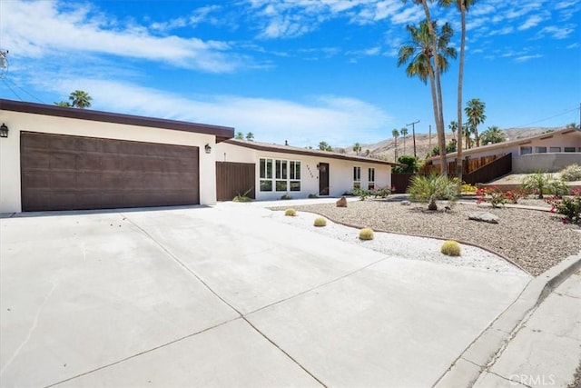 ranch-style home featuring a garage