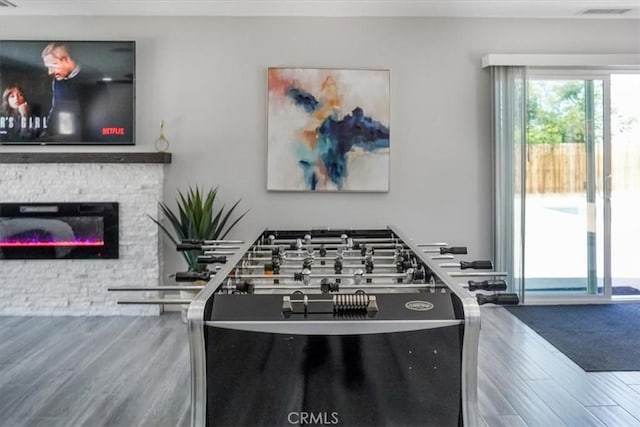 39120 Paradise Way, Cathedral City, CA 92234 - rec room featuring a stone fireplace and hardwood / wood-style flooring