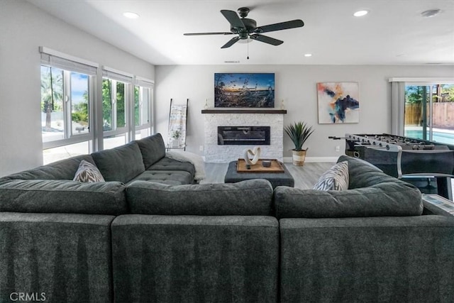 39120 Paradise Way, Cathedral City, CA 92234 - living room with hardwood / wood-style flooring, ceiling fan, and a fireplace