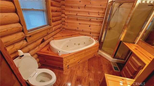 bathroom featuring plus walk in shower and toilet