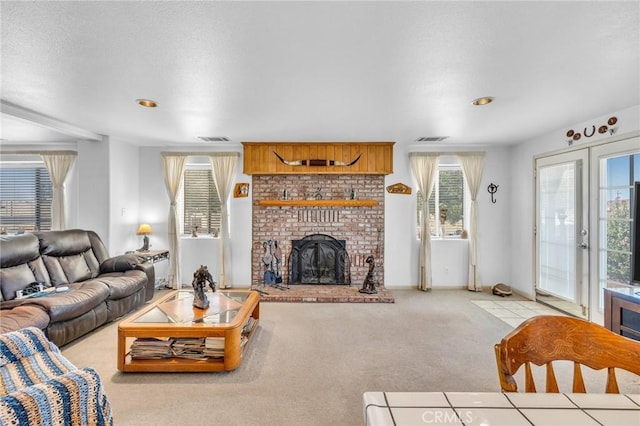 living room with light carpet, a brick fireplace, and french doors