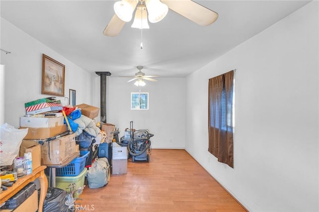 interior space with light wood-type flooring and ceiling fan