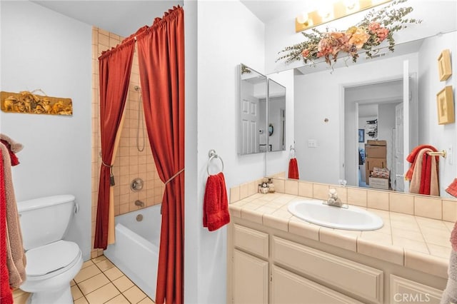 full bathroom featuring vanity, tile patterned floors, toilet, and shower / bath combo with shower curtain