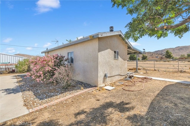 view of home's exterior with a mountain view