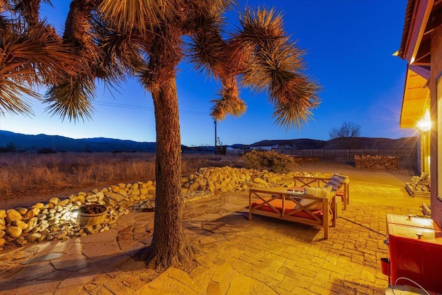 patio terrace at dusk with a mountain view