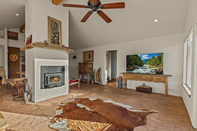 living room featuring ceiling fan, a wealth of natural light, and high vaulted ceiling