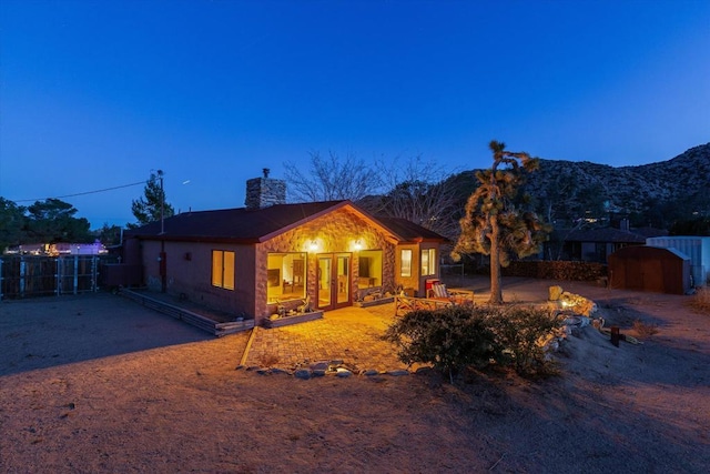 view of front of property with a mountain view