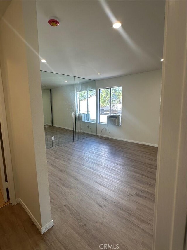 spare room with hardwood / wood-style floors