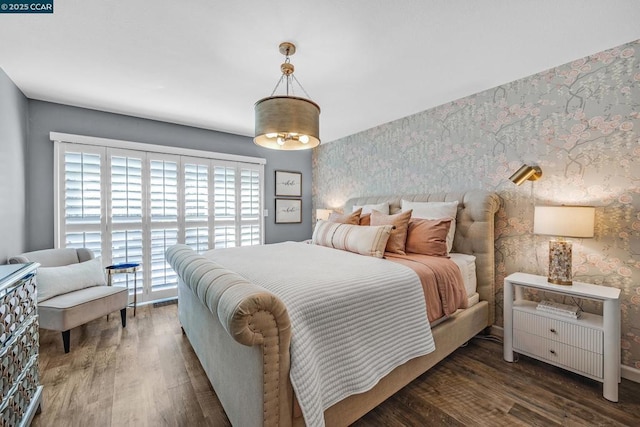 bedroom with dark wood-type flooring