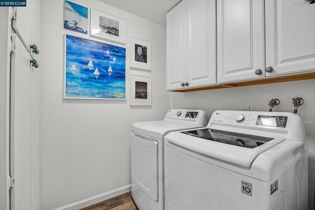 laundry room with separate washer and dryer, dark hardwood / wood-style floors, and cabinets