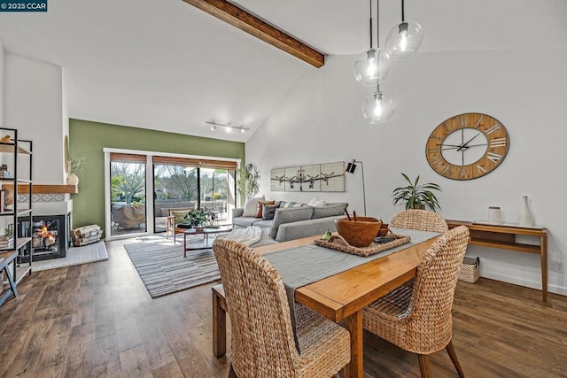 dining area with beam ceiling, high vaulted ceiling, and dark hardwood / wood-style flooring