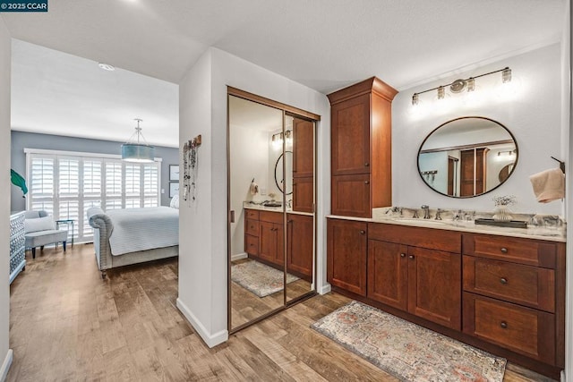 bathroom featuring vanity and hardwood / wood-style flooring