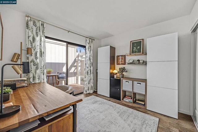 office area with wood-type flooring