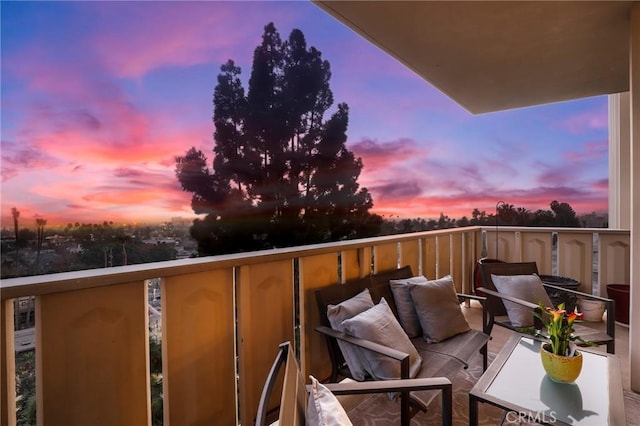 view of balcony at dusk