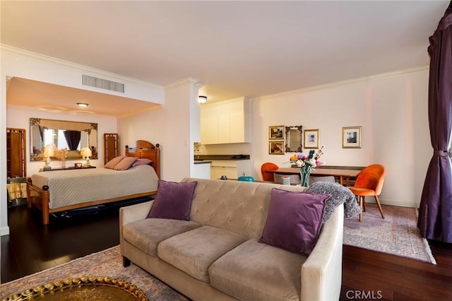 bedroom featuring crown molding and dark hardwood / wood-style floors