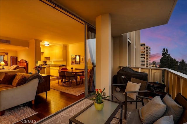 view of balcony at dusk