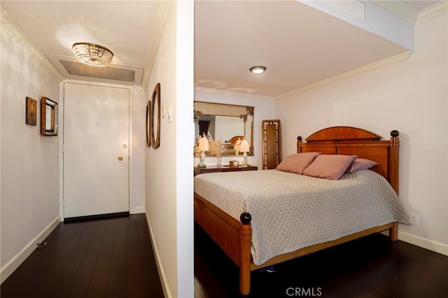 bedroom featuring ornamental molding and dark hardwood / wood-style floors