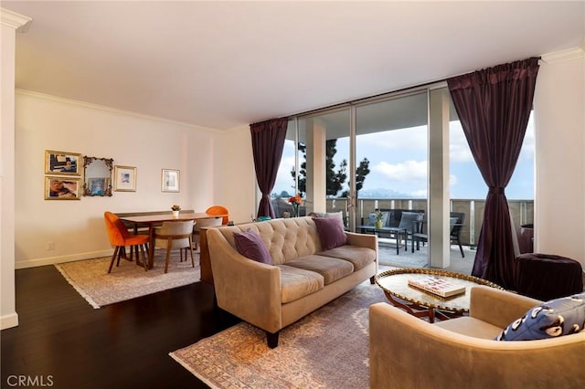 living room featuring crown molding, dark hardwood / wood-style flooring, and a wall of windows