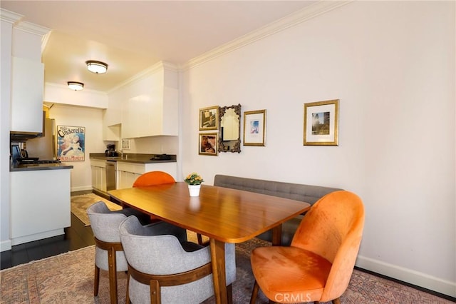 dining room with crown molding and dark wood-type flooring