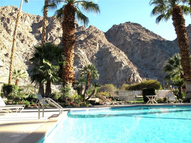 view of swimming pool featuring a mountain view