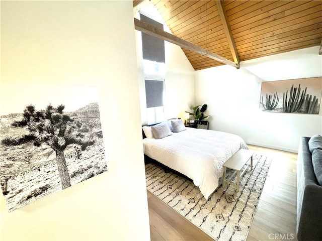 bedroom featuring hardwood / wood-style flooring, wooden ceiling, and vaulted ceiling with beams