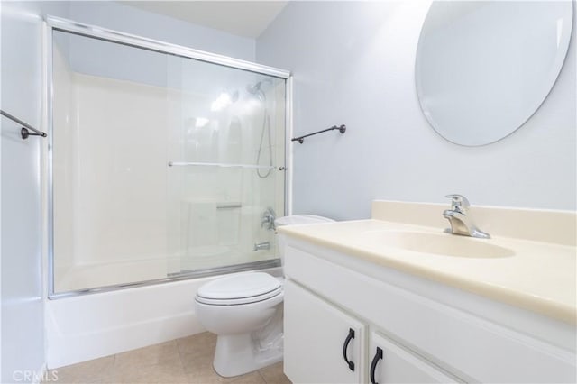 full bathroom featuring vanity, tile patterned floors, toilet, and combined bath / shower with glass door