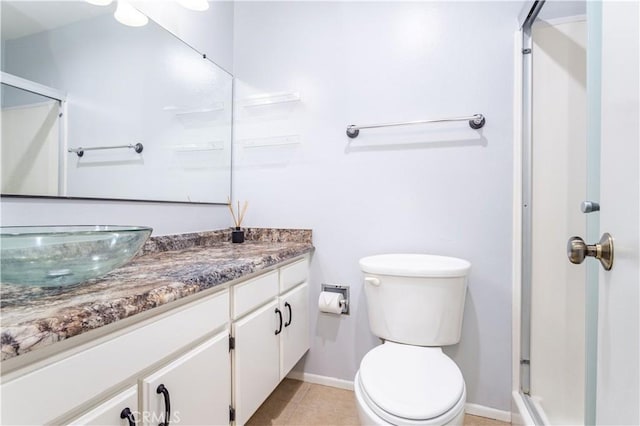 bathroom with vanity, an enclosed shower, tile patterned flooring, and toilet