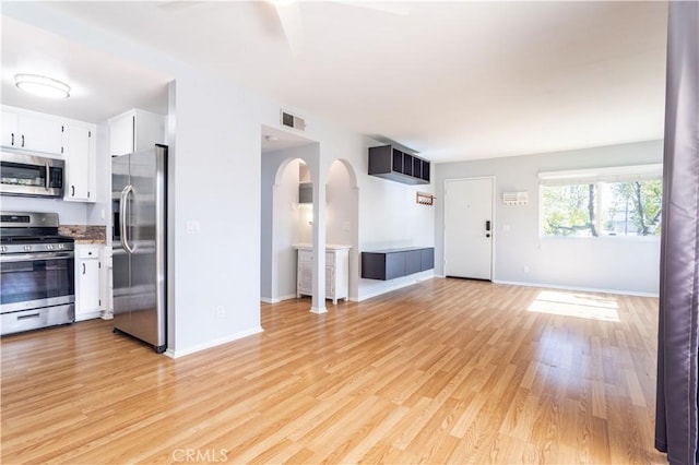 unfurnished living room with light hardwood / wood-style flooring