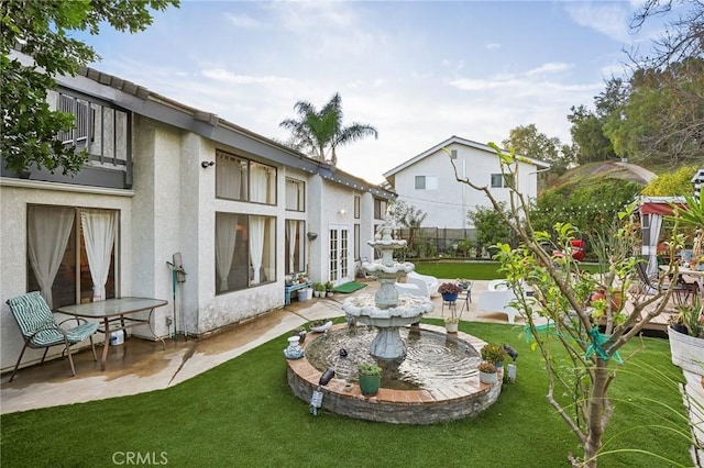 view of yard with french doors and a patio area