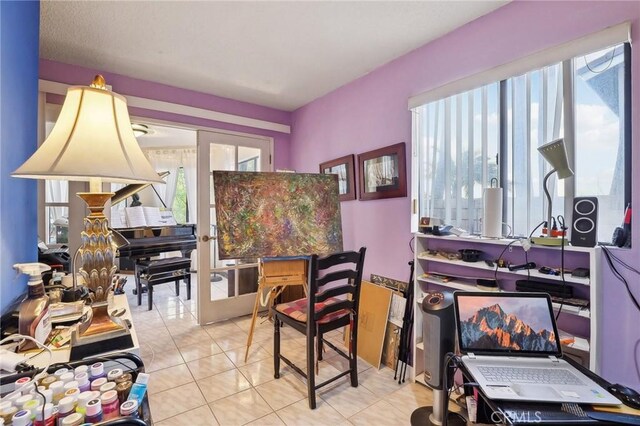 office area with light tile patterned floors and french doors