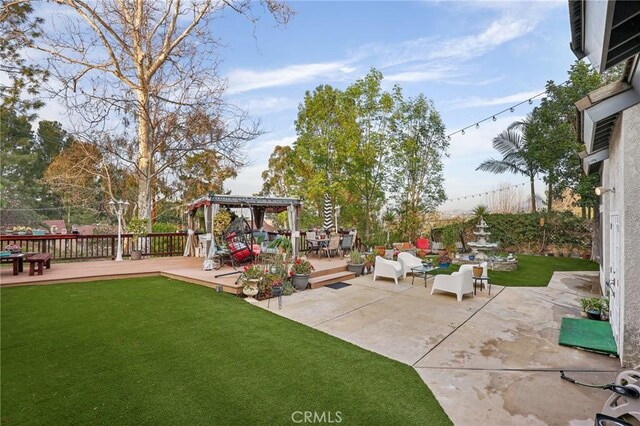 view of patio featuring an outdoor living space and a deck