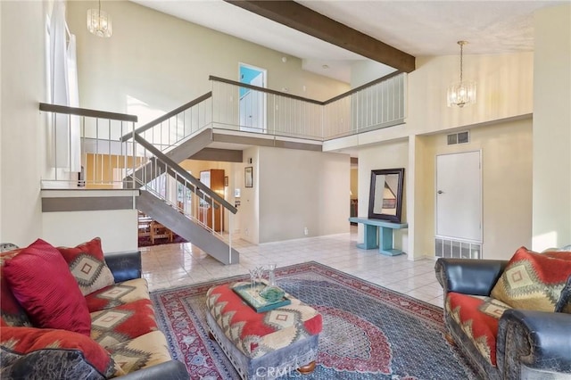 living room featuring visible vents, beamed ceiling, an inviting chandelier, tile patterned flooring, and stairs