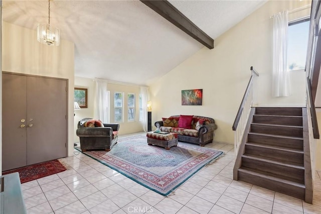 living room with beamed ceiling, stairs, light tile patterned floors, an inviting chandelier, and high vaulted ceiling