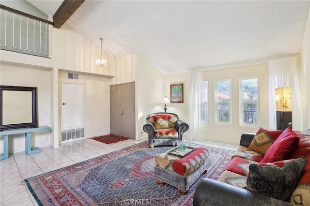 living room featuring tile patterned flooring, visible vents, a notable chandelier, and beam ceiling