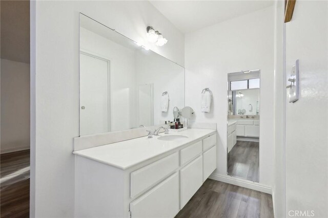 bathroom featuring vanity and hardwood / wood-style floors