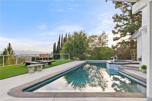 view of swimming pool featuring a fenced in pool, a patio area, a fenced backyard, and an in ground hot tub