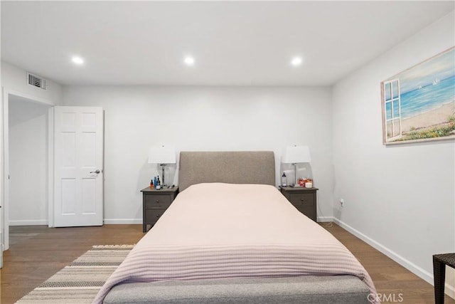 bedroom featuring recessed lighting, visible vents, baseboards, and wood finished floors