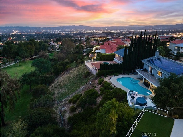 aerial view at dusk with a mountain view