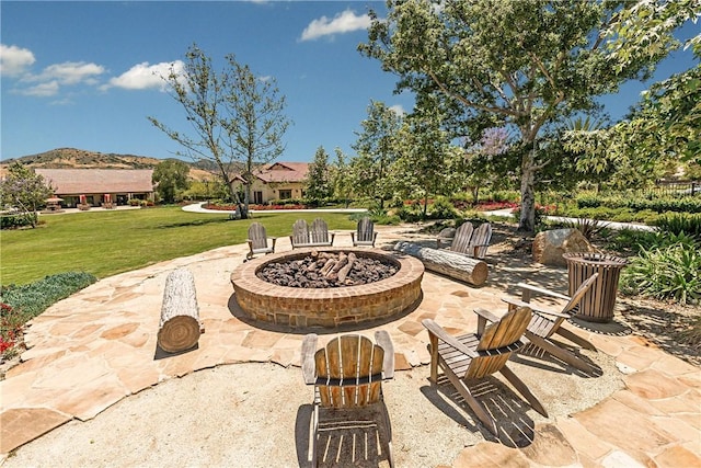 view of patio with a fire pit