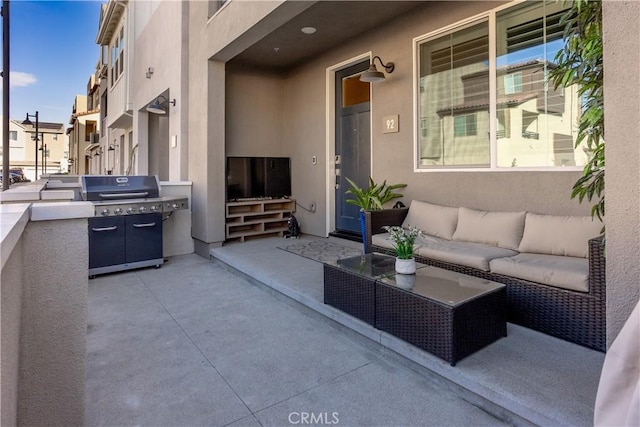 view of patio / terrace with an outdoor living space and area for grilling