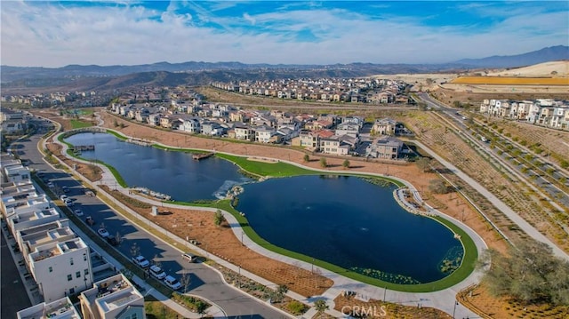 birds eye view of property featuring a water and mountain view