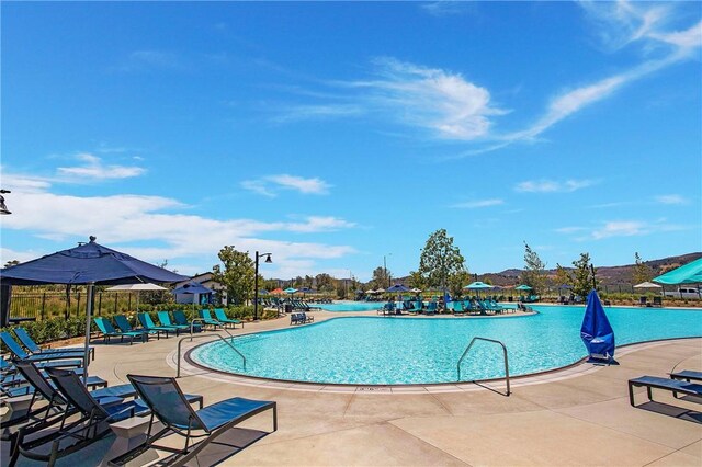 view of swimming pool with a patio area